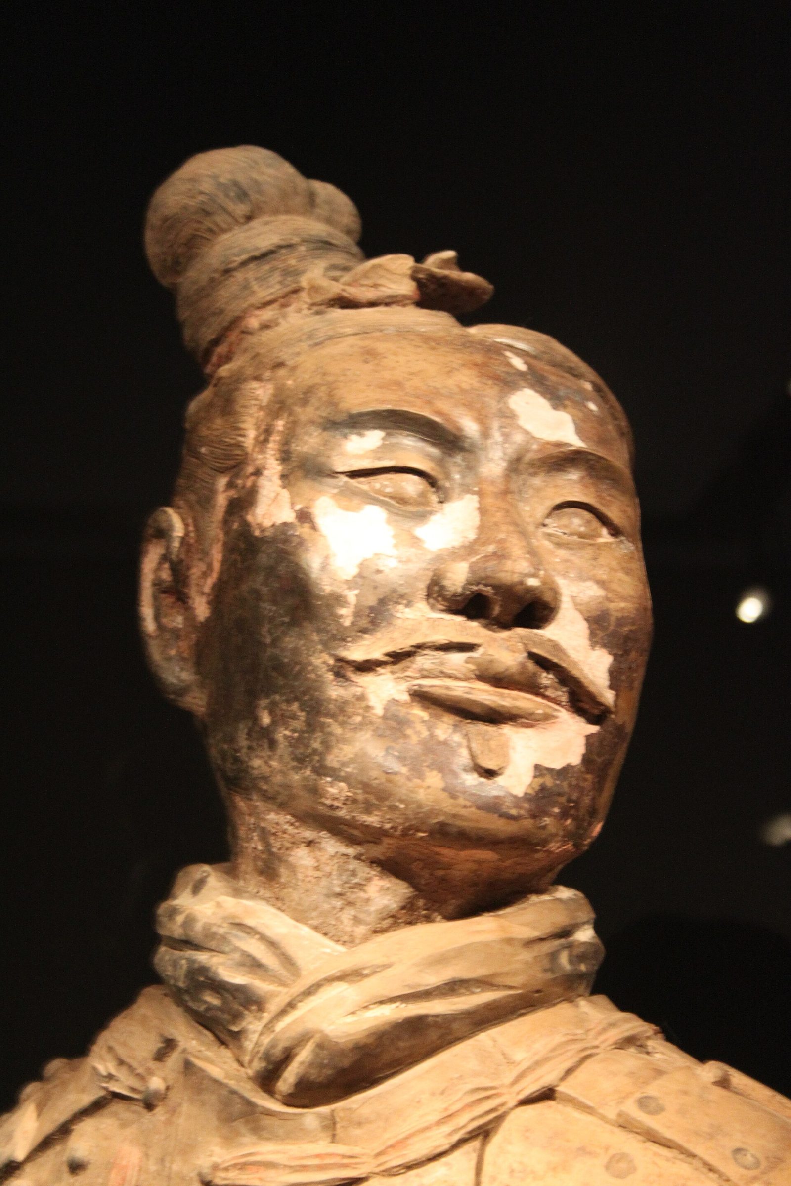 Kneeling archer figure with traces of original paint